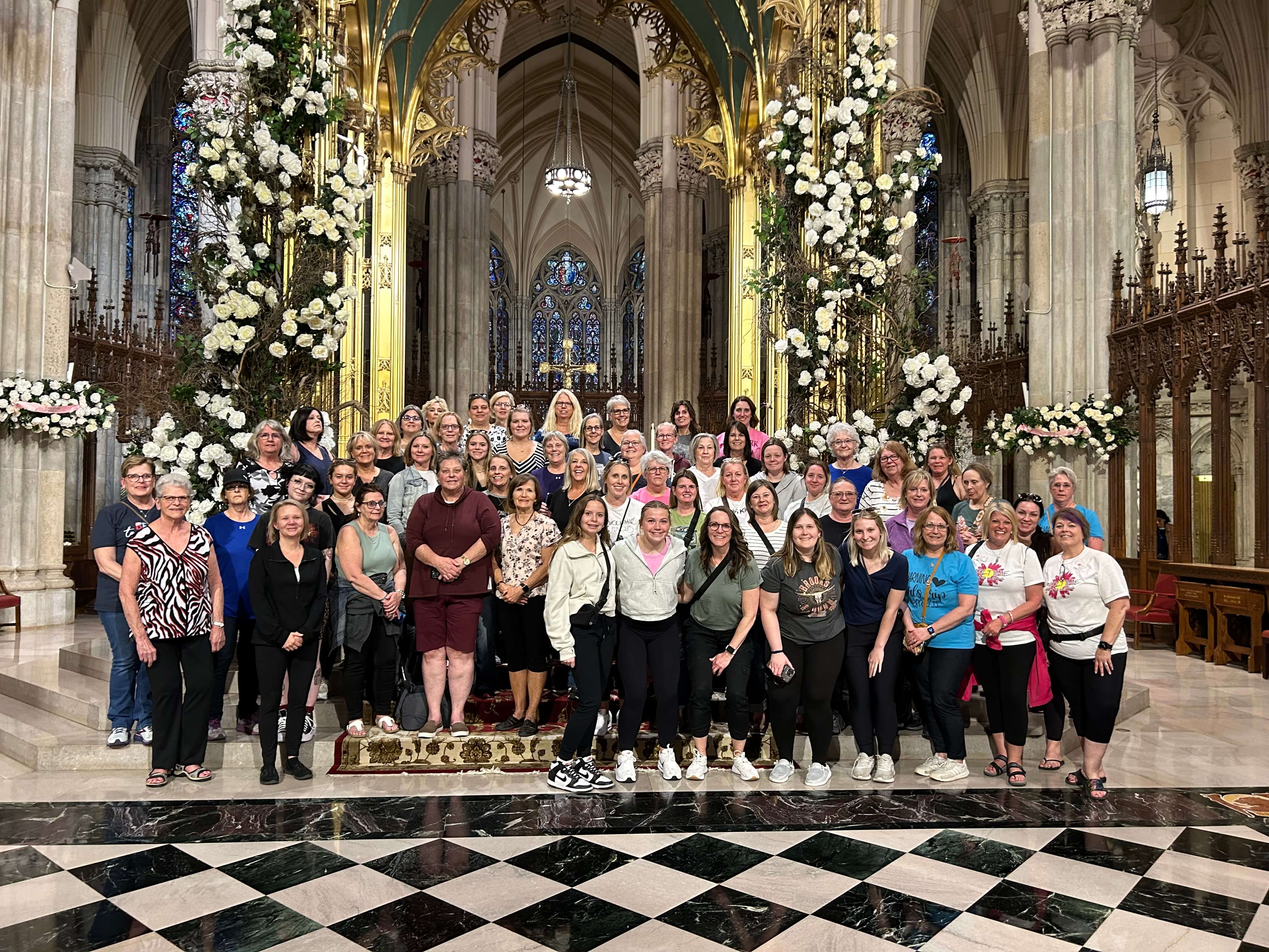 School group in the Lady Chapel with a young priest